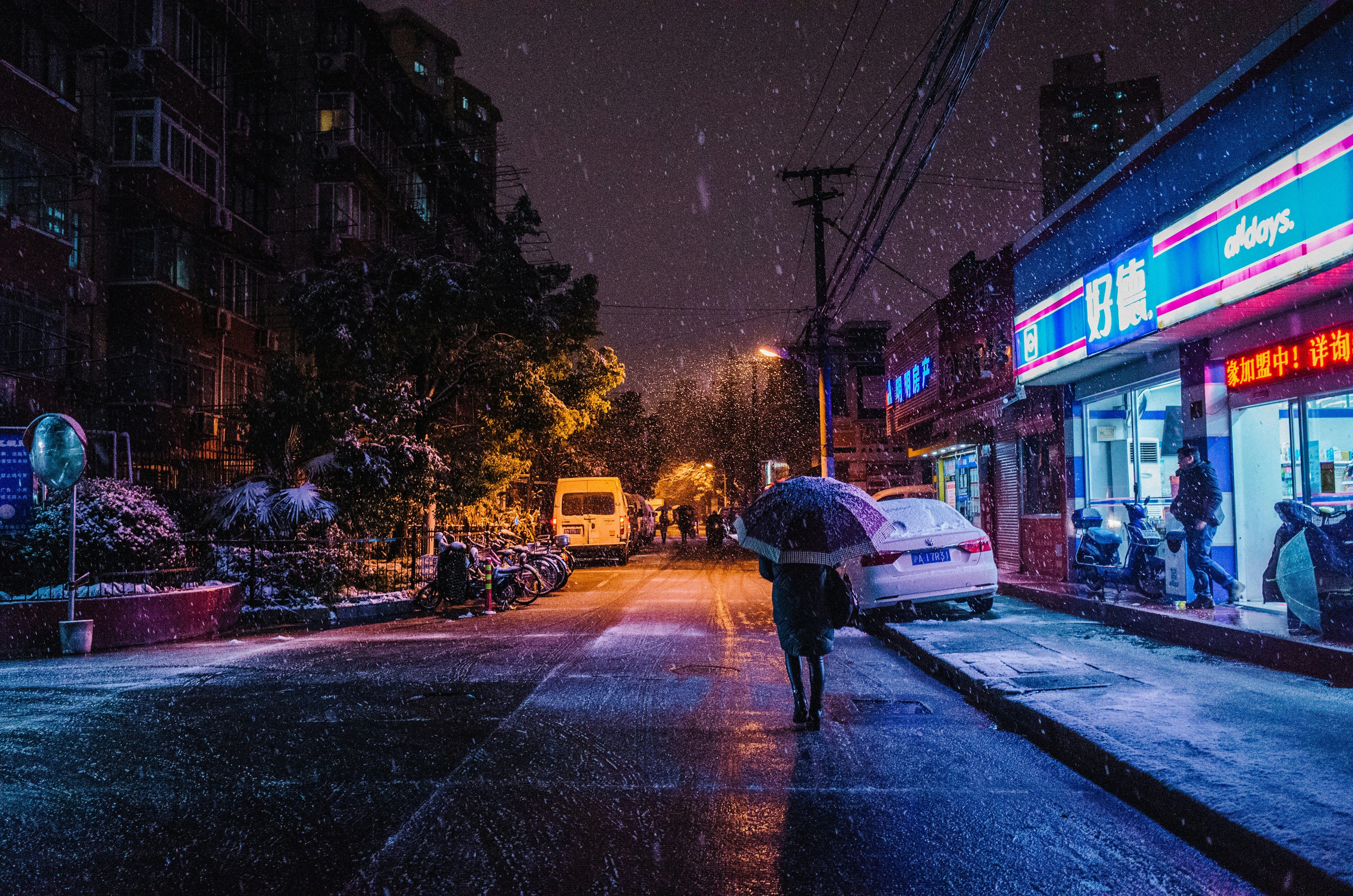 A night city covered in snowflakes